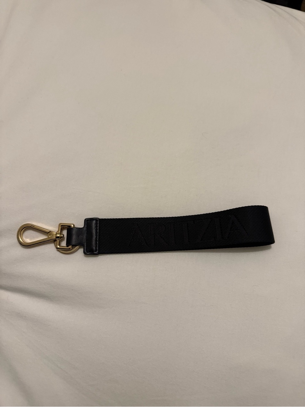 Aritzia Black Wrist Strap with Gold Hardware